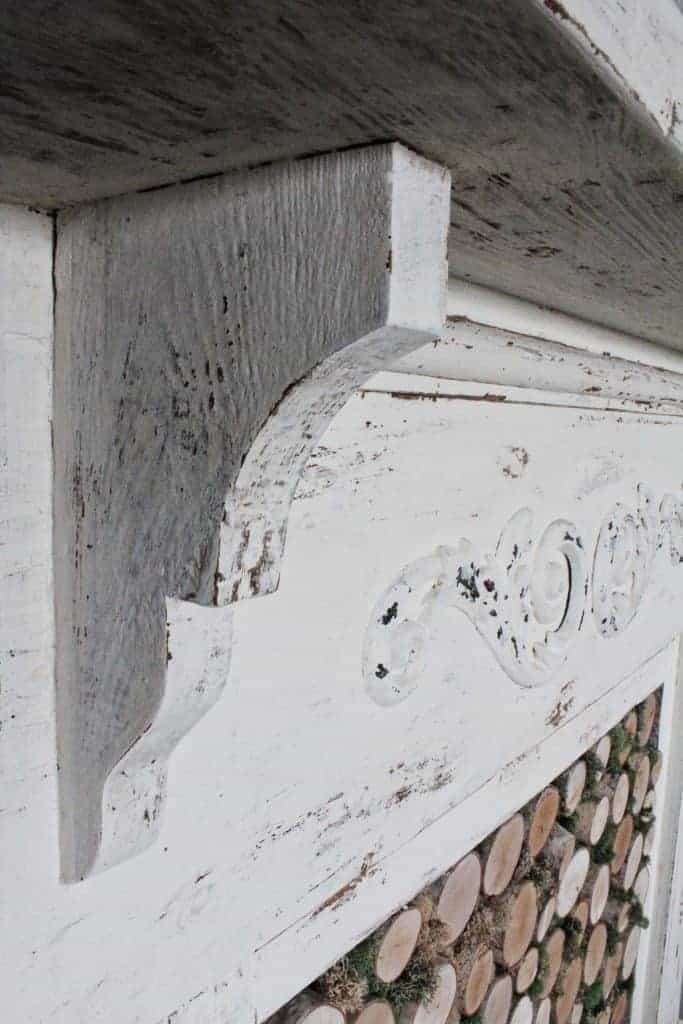 antique mantel with chippy white paint 