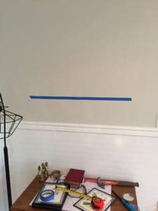 how to hang pictures in a row and evenly with painters tape