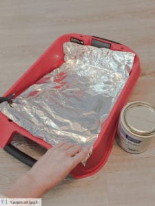 line a paint tray with aluminum foil 