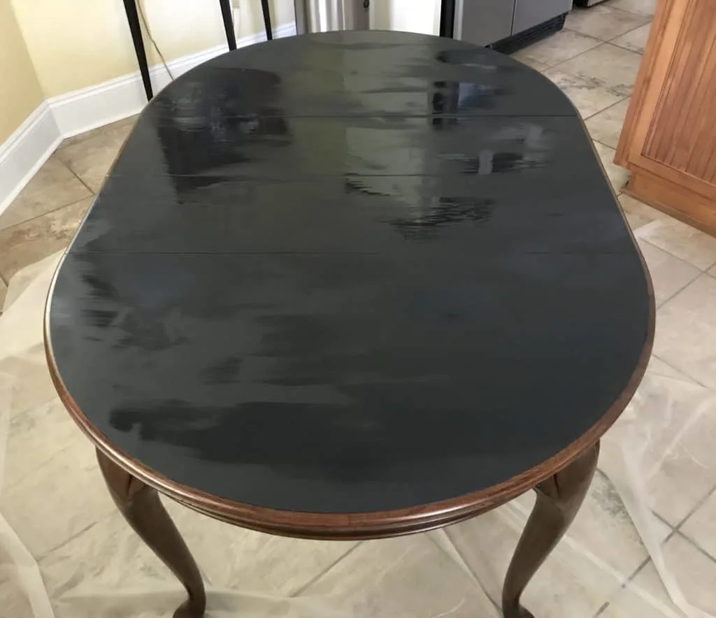 chalk painted table top with second coat of paint 
