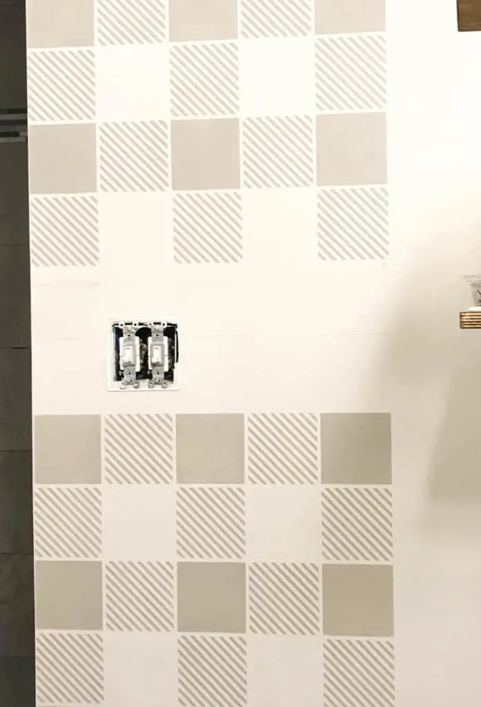 stenciling a wall around a light switch 