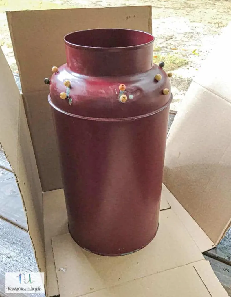 spray painting the vintage milk can