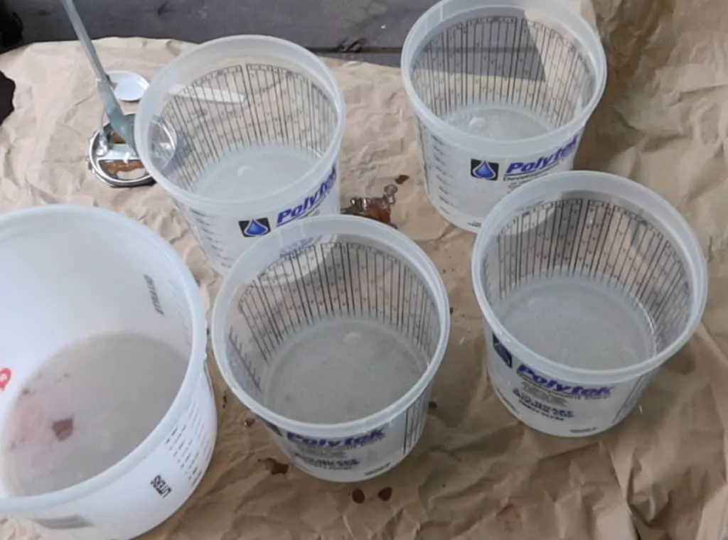 Epoxy poured into different buckets