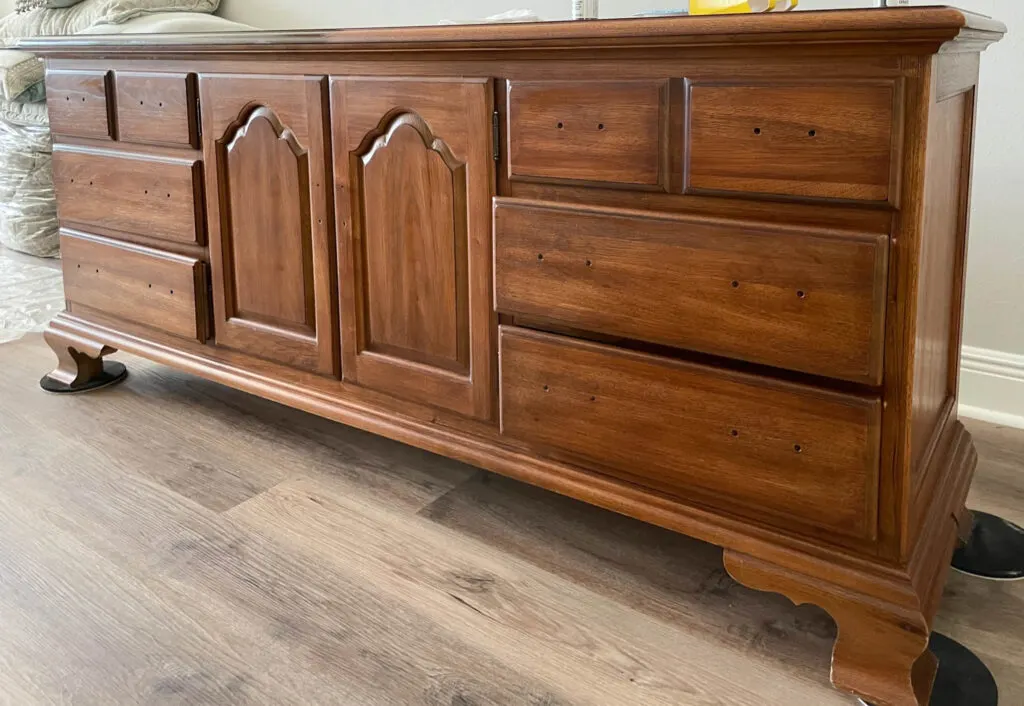 solid wood dresser with orange wood finish 
