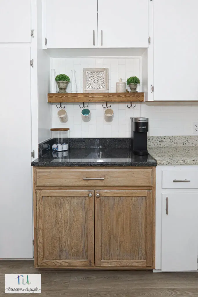 coffee bar in kitchen with subway tile and floating shelf