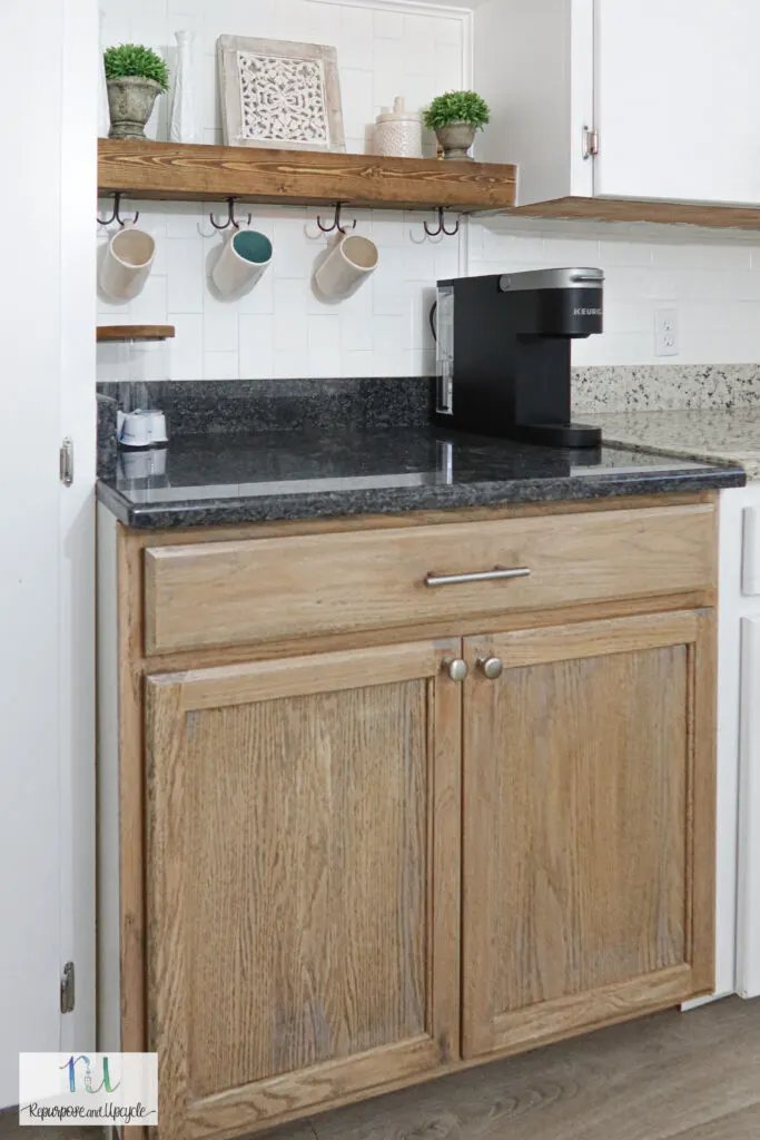 DIY coffee bar with two toned cabinets and dark granite