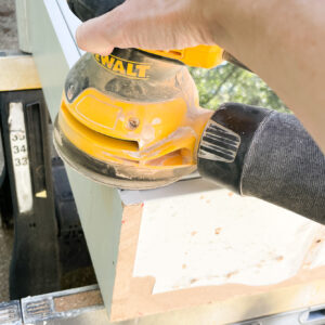 sanding the cabinet